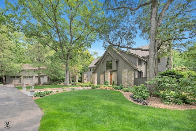 4776A W State Route 102, Bourbonnais, IL 60914 - view of front facade featuring stone siding, a front yard, and a shingled roof