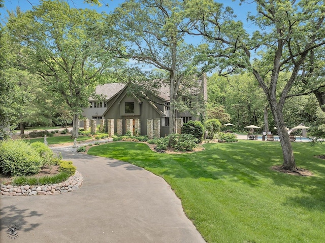 4776A W State Route 102, Bourbonnais, IL 60914 - view of side of property featuring stone siding and a lawn