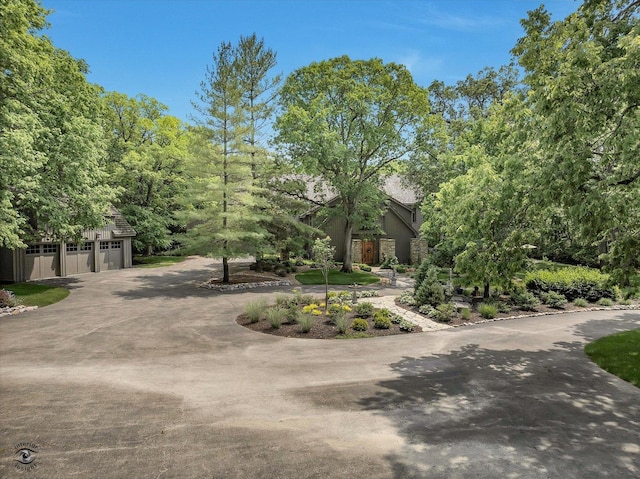 4776A W State Route 102, Bourbonnais, IL 60914 - view of front of home featuring driveway, a garage, stone siding, and stucco siding