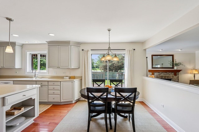 63 E Cambridge Ct, Grayslake, IL 60030 - dining area with light wood-type flooring, a fireplace, and recessed lighting