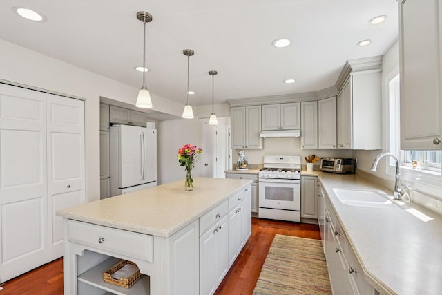 63 E Cambridge Ct, Grayslake, IL 60030 - kitchen featuring white appliances, under cabinet range hood, light countertops, a kitchen island, and recessed lighting