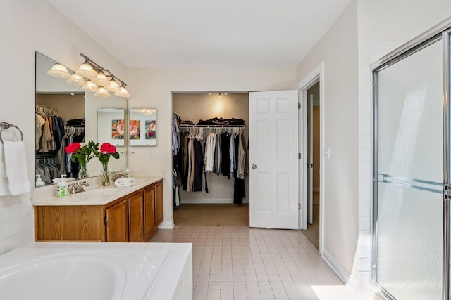 63 E Cambridge Ct, Grayslake, IL 60030 - bathroom with a walk in closet, double vanity, a stall shower, a bath, and tile patterned flooring