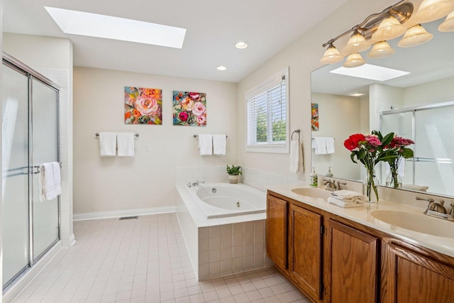 63 E Cambridge Ct, Grayslake, IL 60030 - bathroom with a skylight, a stall shower, tile patterned flooring, and recessed lighting