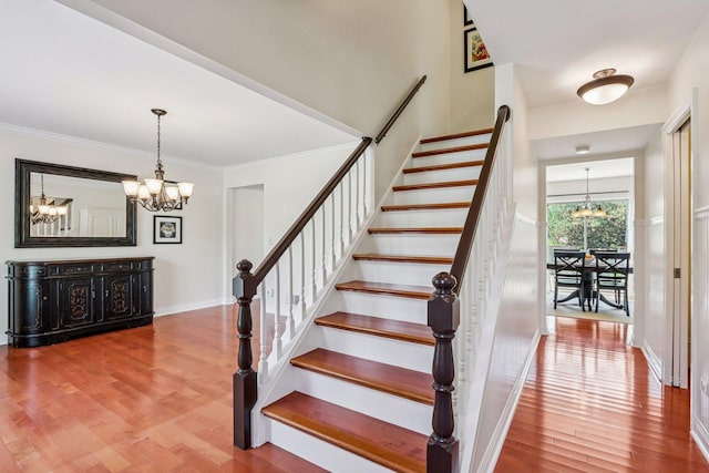 63 E Cambridge Ct, Grayslake, IL 60030 - staircase with a chandelier, wood finished floors, and ornamental molding