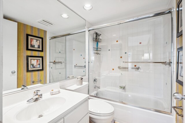1718 Northfield Sq Unit F, Northfield, IL 60093 - full bath with vanity, bath / shower combo with glass door, toilet, and recessed lighting