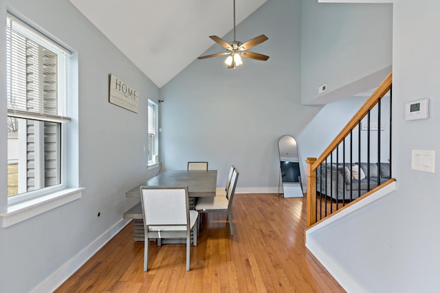 15256 State St, South Holland, IL 60473 - dining area featuring ceiling fan, high vaulted ceiling, stairs, hardwood / wood-style flooring, and baseboards