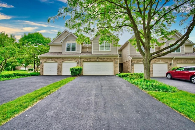 6131 Wingate Dr, Lisle, IL 60532 - townhome / multi-family property with brick siding, a garage, and driveway