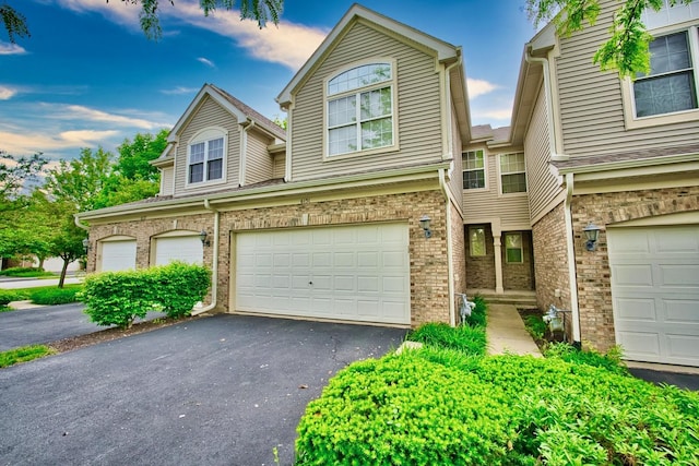 6131 Wingate Dr, Lisle, IL 60532 - townhome / multi-family property with a garage, driveway, and brick siding