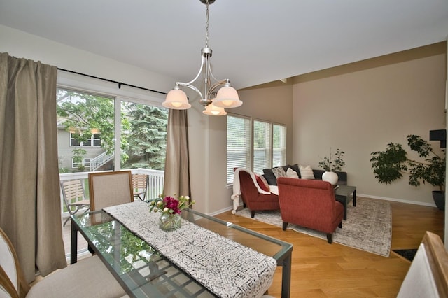 6131 Wingate Dr, Lisle, IL 60532 - dining space featuring a chandelier, healthy amount of natural light, baseboards, and light wood-style flooring