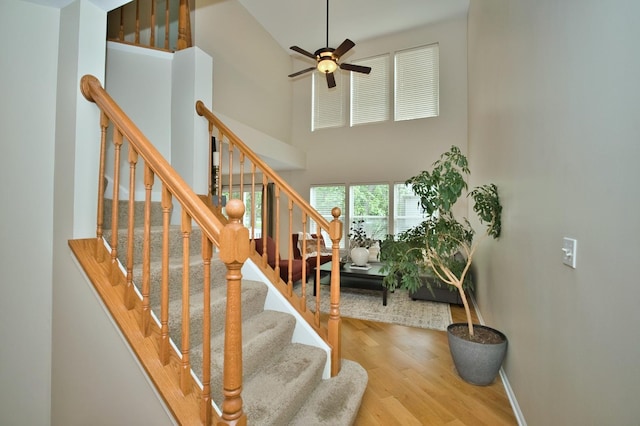 6131 Wingate Dr, Lisle, IL 60532 - staircase featuring wood finished floors, a high ceiling, ceiling fan, and baseboards