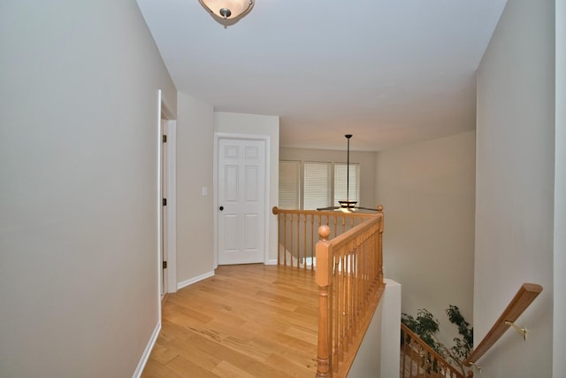 6131 Wingate Dr, Lisle, IL 60532 - hallway with an upstairs landing, light wood-style flooring, and baseboards