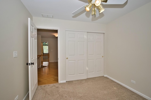 6131 Wingate Dr, Lisle, IL 60532 - unfurnished bedroom featuring carpet floors, baseboards, a closet, and a ceiling fan
