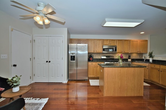 6131 Wingate Dr, Lisle, IL 60532 - kitchen with appliances with stainless steel finishes, a sink, a kitchen island, dark wood-style floors, and recessed lighting