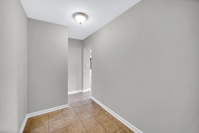 1455 Reckinger Rd, Aurora, IL 60505 - empty room featuring light tile patterned flooring and baseboards