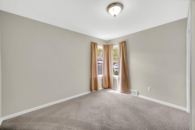 1455 Reckinger Rd, Aurora, IL 60505 - spare room with carpet and baseboards