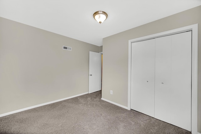 1455 Reckinger Rd, Aurora, IL 60505 - unfurnished bedroom with carpet floors, baseboards, and a closet