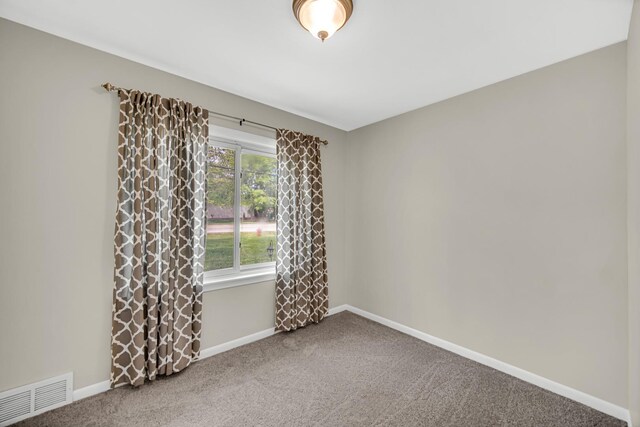 1455 Reckinger Rd, Aurora, IL 60505 - carpeted spare room featuring baseboards