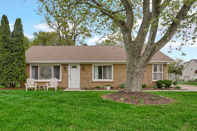 1455 Reckinger Rd, Aurora, IL 60505 - single story home featuring brick siding, a front yard, a shingled roof, and a chimney