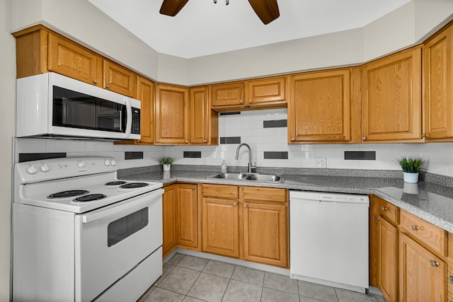 1455 Reckinger Rd, Aurora, IL 60505 - kitchen featuring white appliances, a sink, ceiling fan, light tile patterned floors, and brown cabinetry