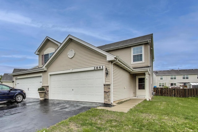 2641 Carlisle Ln, Hampshire, IL 60140 - traditional-style home featuring driveway, an attached garage, and stone siding