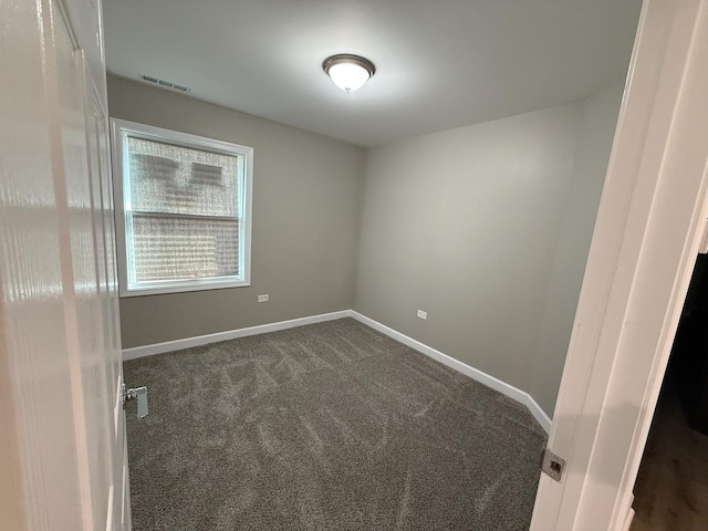 363 Indianwood Blvd, Park Forest, IL 60466 - spare room featuring dark colored carpet and baseboards