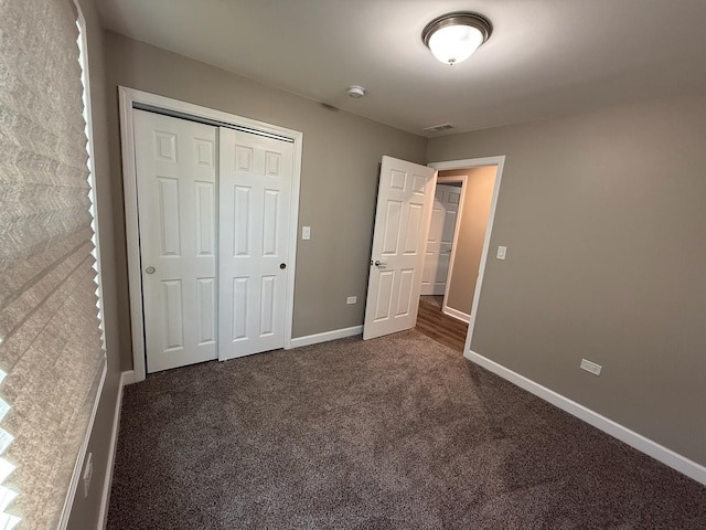 363 Indianwood Blvd, Park Forest, IL 60466 - unfurnished bedroom with dark colored carpet and a closet