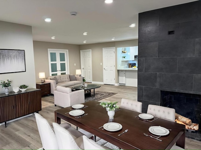 363 Indianwood Blvd, Park Forest, IL 60466 - dining space with light wood-type flooring, a tile fireplace, and recessed lighting