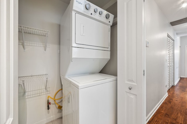 4800 S St Lawrence Ave Unit 3S, Chicago, IL 60615 - laundry area with stacked washer / drying machine and wood finished floors