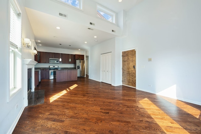 4800 S St Lawrence Ave Unit 3S, Chicago, IL 60615 - unfurnished living room with a high ceiling, dark wood-style floors, and recessed lighting