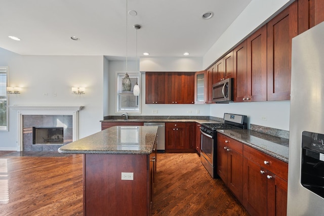 4800 S St Lawrence Ave Unit 3S, Chicago, IL 60615 - kitchen featuring appliances with stainless steel finishes, dark wood-type flooring, a kitchen island, glass insert cabinets, and dark stone counters