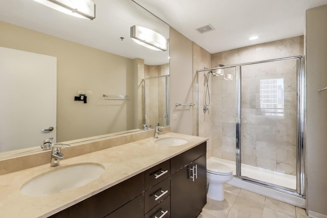 123 S Green St Unit 1101B, Chicago, IL 60607 - bathroom featuring toilet, a stall shower, double vanity, and tile patterned flooring