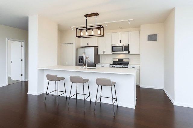 123 S Green St Unit 1101B, Chicago, IL 60607 - kitchen featuring stainless steel appliances, a sink, a kitchen breakfast bar, and a peninsula