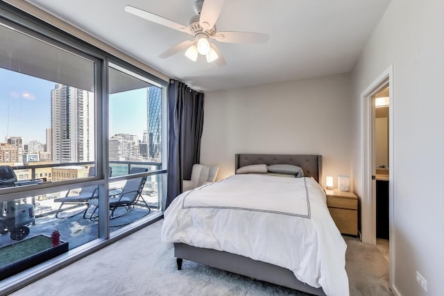 123 S Green St Unit 1101B, Chicago, IL 60607 - carpeted bedroom featuring a city view, a ceiling fan, and a wall of windows