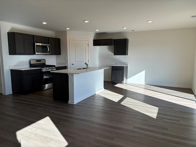 2274 Elderberry Ct, Wonder Lake, IL 60097 - kitchen featuring stainless steel appliances, an island with sink, baseboards, recessed lighting, and dark wood finished floors