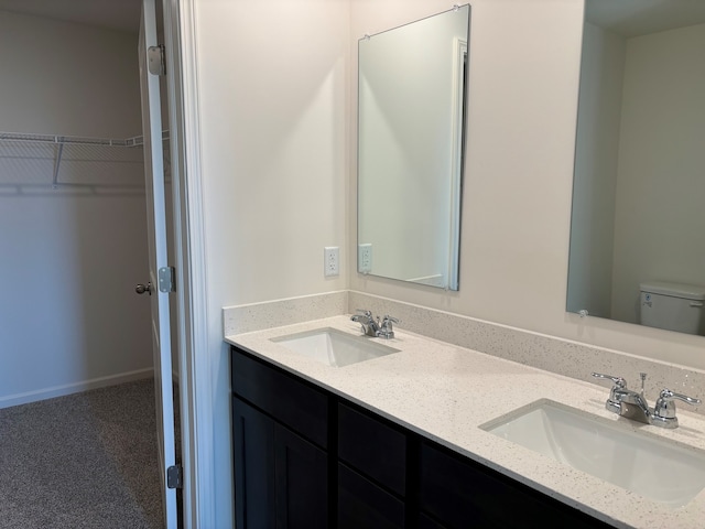 2274 Elderberry Ct, Wonder Lake, IL 60097 - full bathroom with toilet, double vanity, and a spacious closet