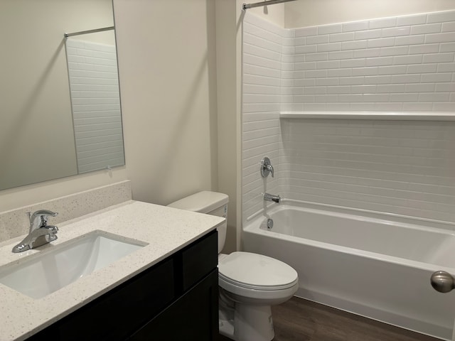 2274 Elderberry Ct, Wonder Lake, IL 60097 - bathroom featuring toilet, vanity, washtub / shower combination, and wood finished floors