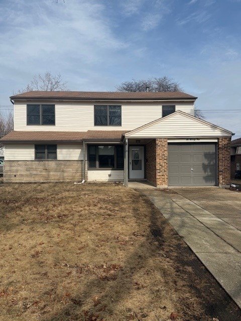 674 E Algonquin Rd, Des Plaines, IL 60016 - view of front of property featuring a garage, concrete driveway, and brick siding