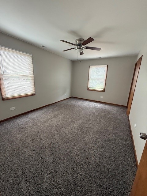 674 E Algonquin Rd, Des Plaines, IL 60016 - carpeted empty room with a ceiling fan and baseboards