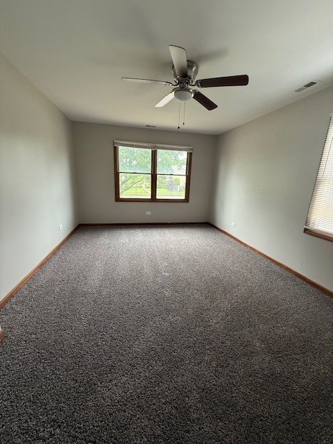 674 E Algonquin Rd, Des Plaines, IL 60016 - empty room with baseboards, ceiling fan, and carpet floors