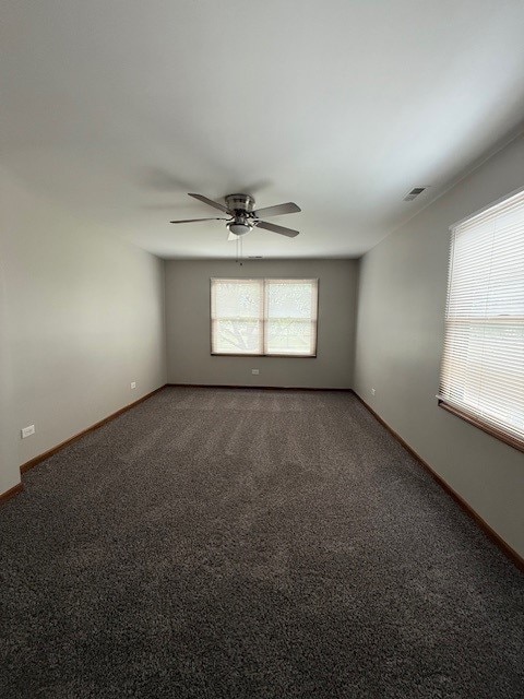 674 E Algonquin Rd, Des Plaines, IL 60016 - unfurnished room featuring carpet floors, a ceiling fan, and baseboards