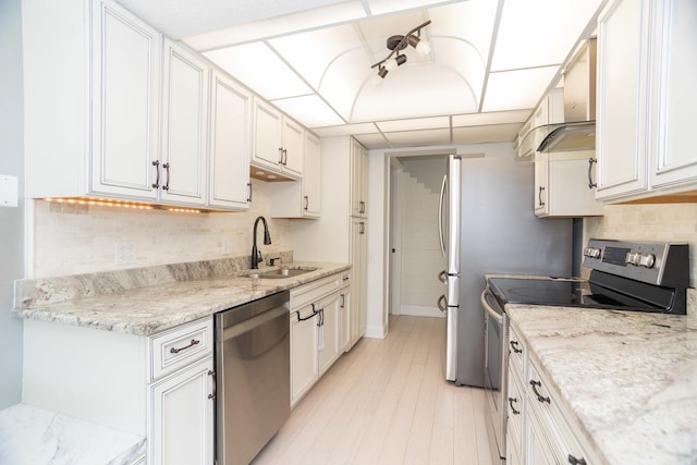 2 S Atrium Way Unit 208, Elmhurst, IL 60126 - kitchen featuring appliances with stainless steel finishes, a sink, tasteful backsplash, and white cabinets