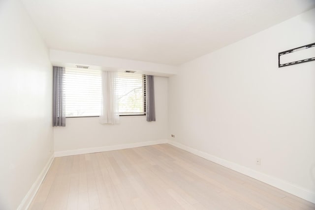 2 S Atrium Way Unit 208, Elmhurst, IL 60126 - empty room with light wood finished floors and baseboards