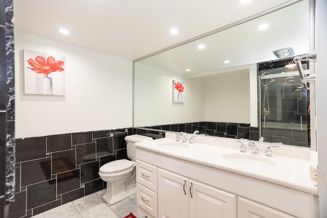 2 S Atrium Way Unit 208, Elmhurst, IL 60126 - bathroom with tile walls, double vanity, recessed lighting, toilet, and an enclosed shower