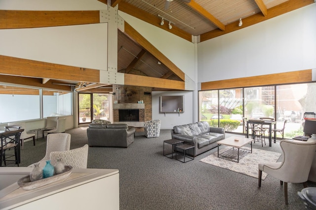 2 S Atrium Way Unit 208, Elmhurst, IL 60126 - carpeted living area featuring high vaulted ceiling, a brick fireplace, healthy amount of natural light, and wooden ceiling with exposed beams