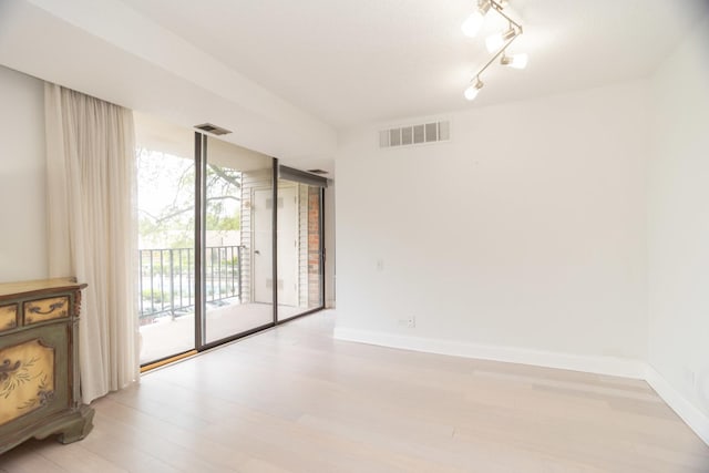 2 S Atrium Way Unit 208, Elmhurst, IL 60126 - spare room with baseboards and light wood-style floors