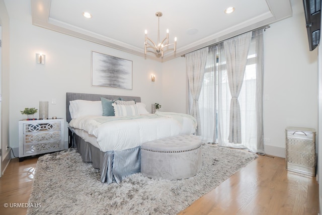1221 E 46th St Unit 1, Chicago, IL 60653 - bedroom with a chandelier, wood finished floors, baseboards, and recessed lighting