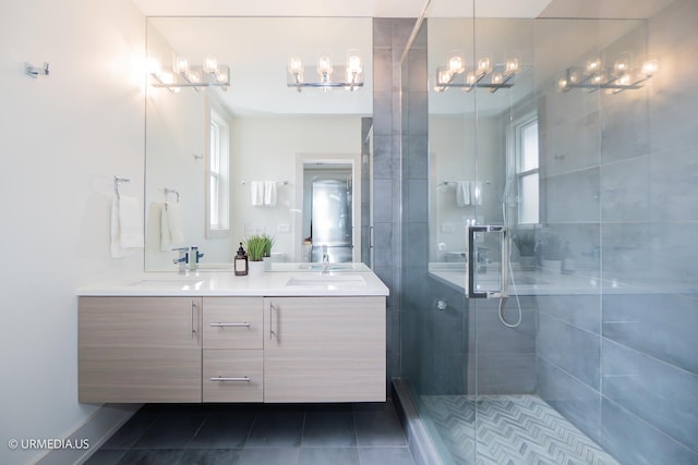 1221 E 46th St Unit 1, Chicago, IL 60653 - bathroom featuring a chandelier, double vanity, tiled shower, and tile patterned flooring