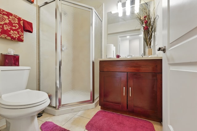 308 E 25th Pl, Chicago, IL 60616 - bathroom featuring toilet, vanity, a shower stall, and tile patterned flooring