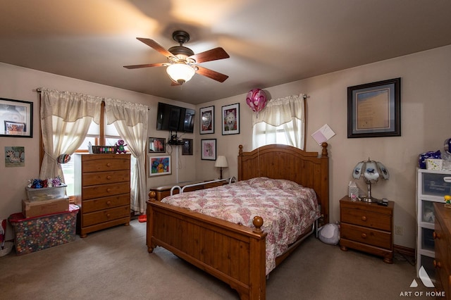 17207 Chase Rd, Dekalb, IL 60115 - bedroom with multiple windows, light colored carpet, and ceiling fan