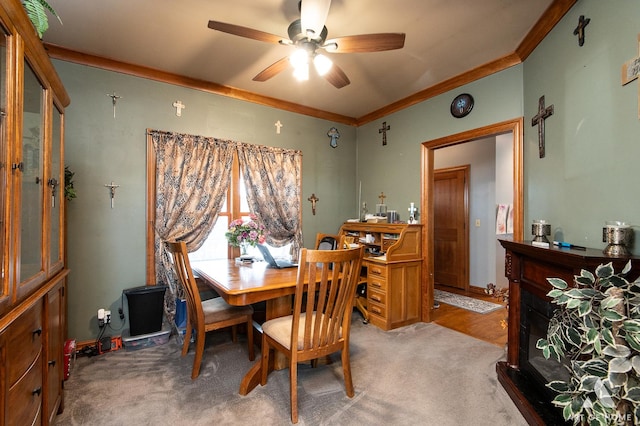 17207 Chase Rd, Dekalb, IL 60115 - dining space with ceiling fan, light carpet, and crown molding